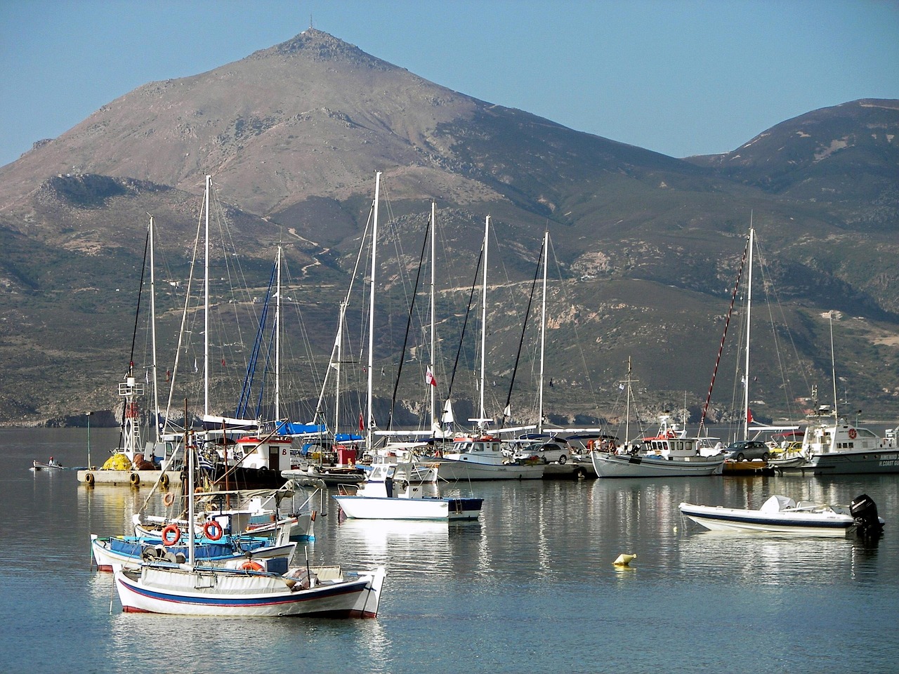 Adamas port town with boats and waterfront in Milos