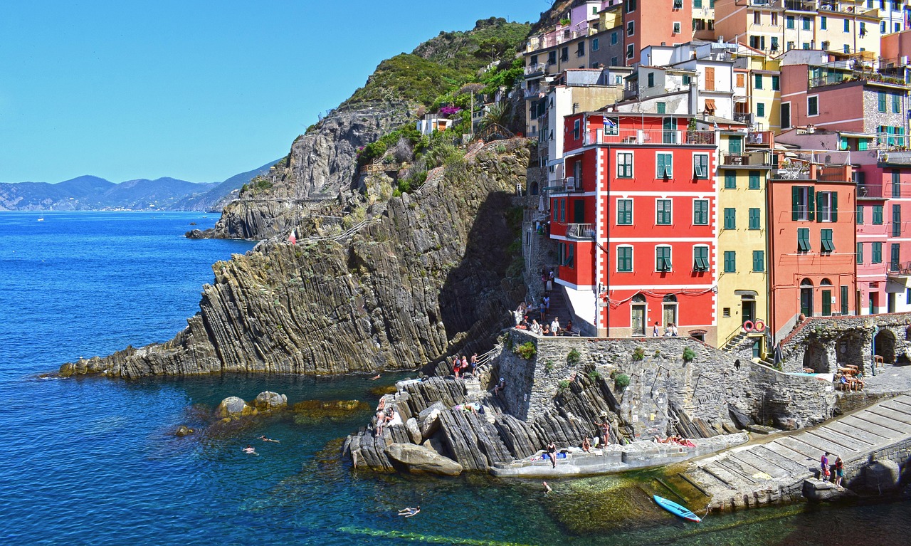 Riomaggiore harbor and colorful houses at dusk