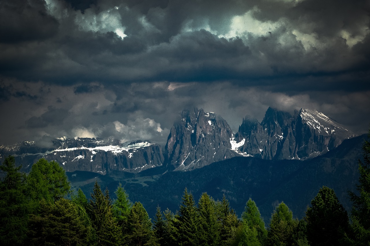 Alpe di Siusi plateau with cabins and Dolomites peaks