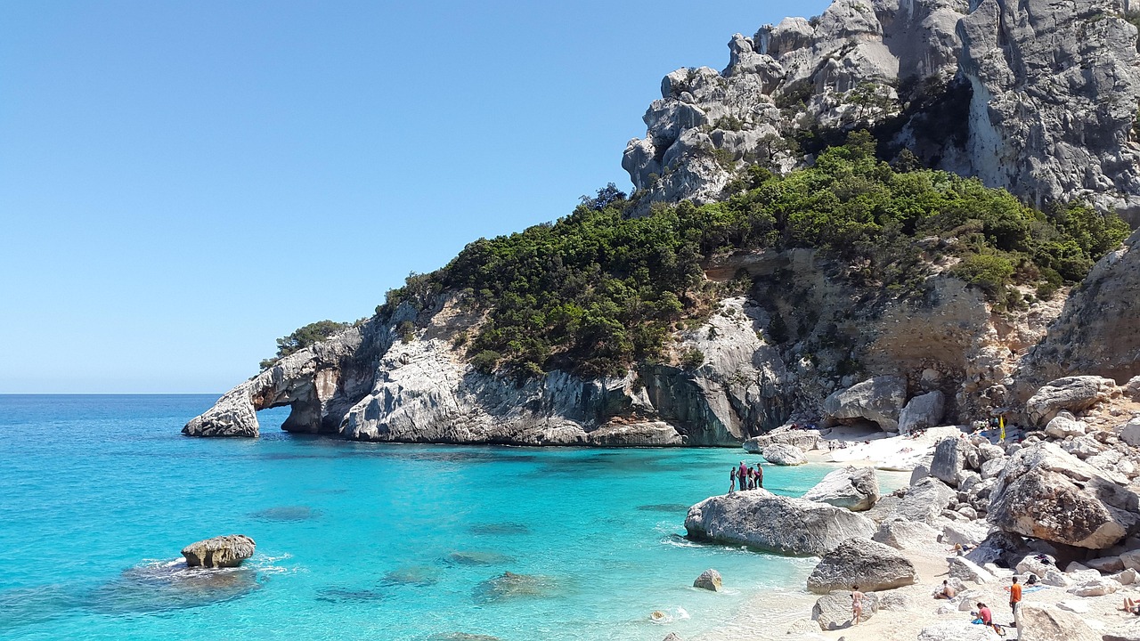 Cala Goloritzé beach with limestone arch and turquoise sea