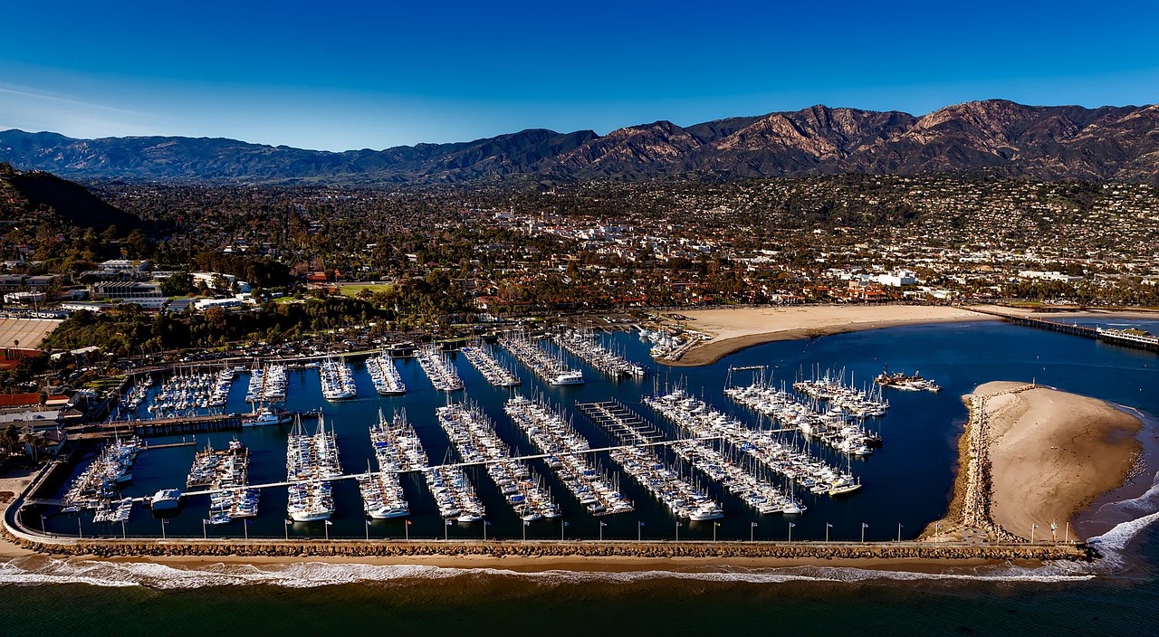 Santa Barbara Harbor with boats and mountains